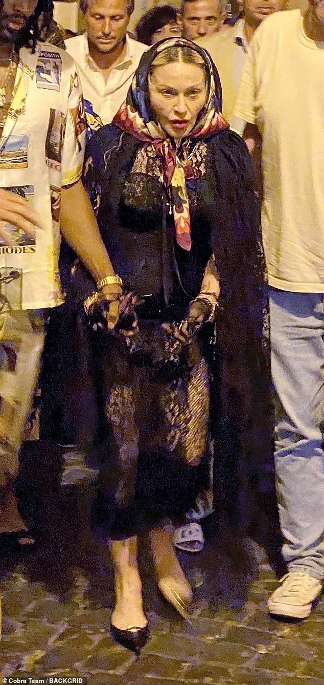 Fans SHOCKED As Tired Madonna Cannot Walk & Is Helped Along Italy’s Cobbled Streets By New Younger Toyboy Lover