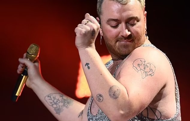 Sam Smith Says They Are Addicted To Tattoos After Surprising Fans In Stunning Silver Jumpsuit