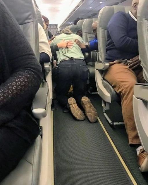 Am I Wrong For Interrupting A Prayer Circle On A Plane Because I Needed To Get To My Seat?