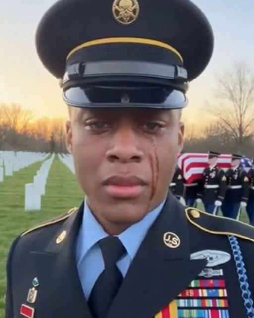 Soldier Sobbing At The Funeral Stops When The Widow Whispers In His Ear